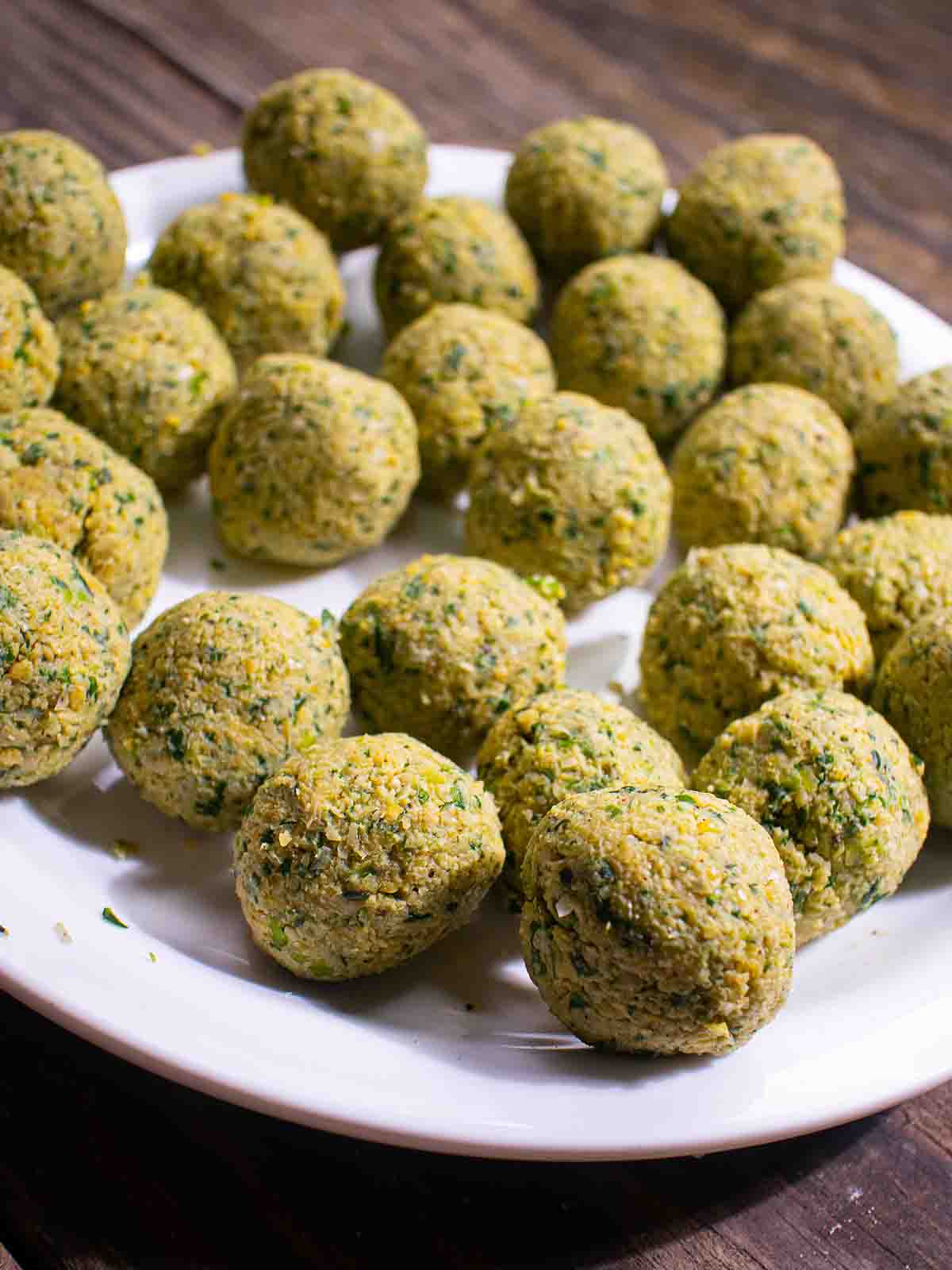 bals of falafel on a white plate