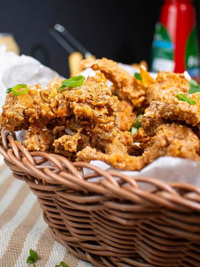 a basket of fried oyster mushrooms (vegan fried chicken)