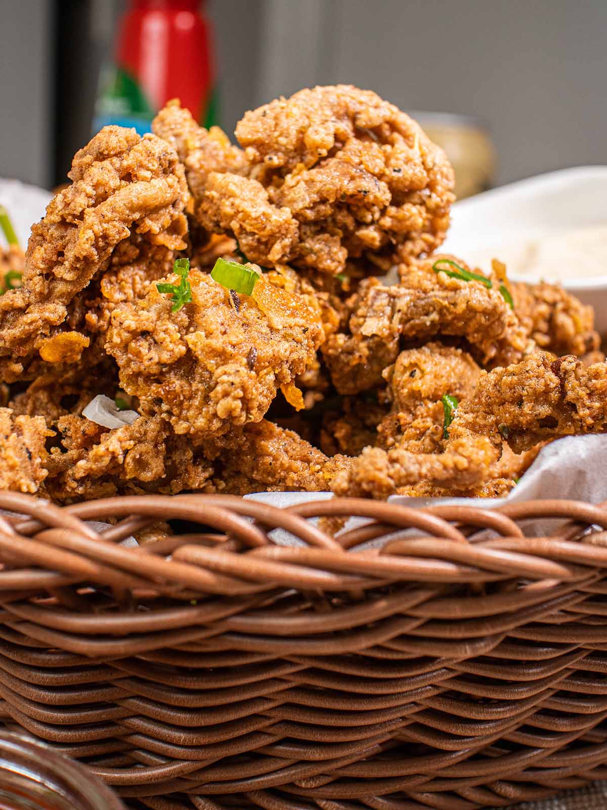 a basket of fried oyster mushrooms (vegan fried chicken)