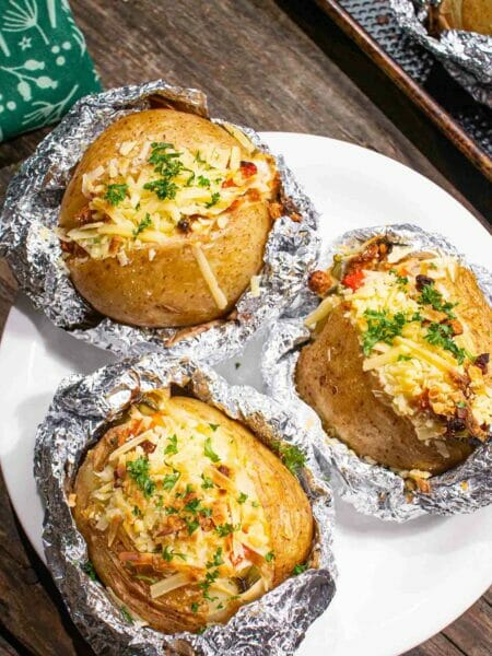 three vegan baked stuffed potatoes