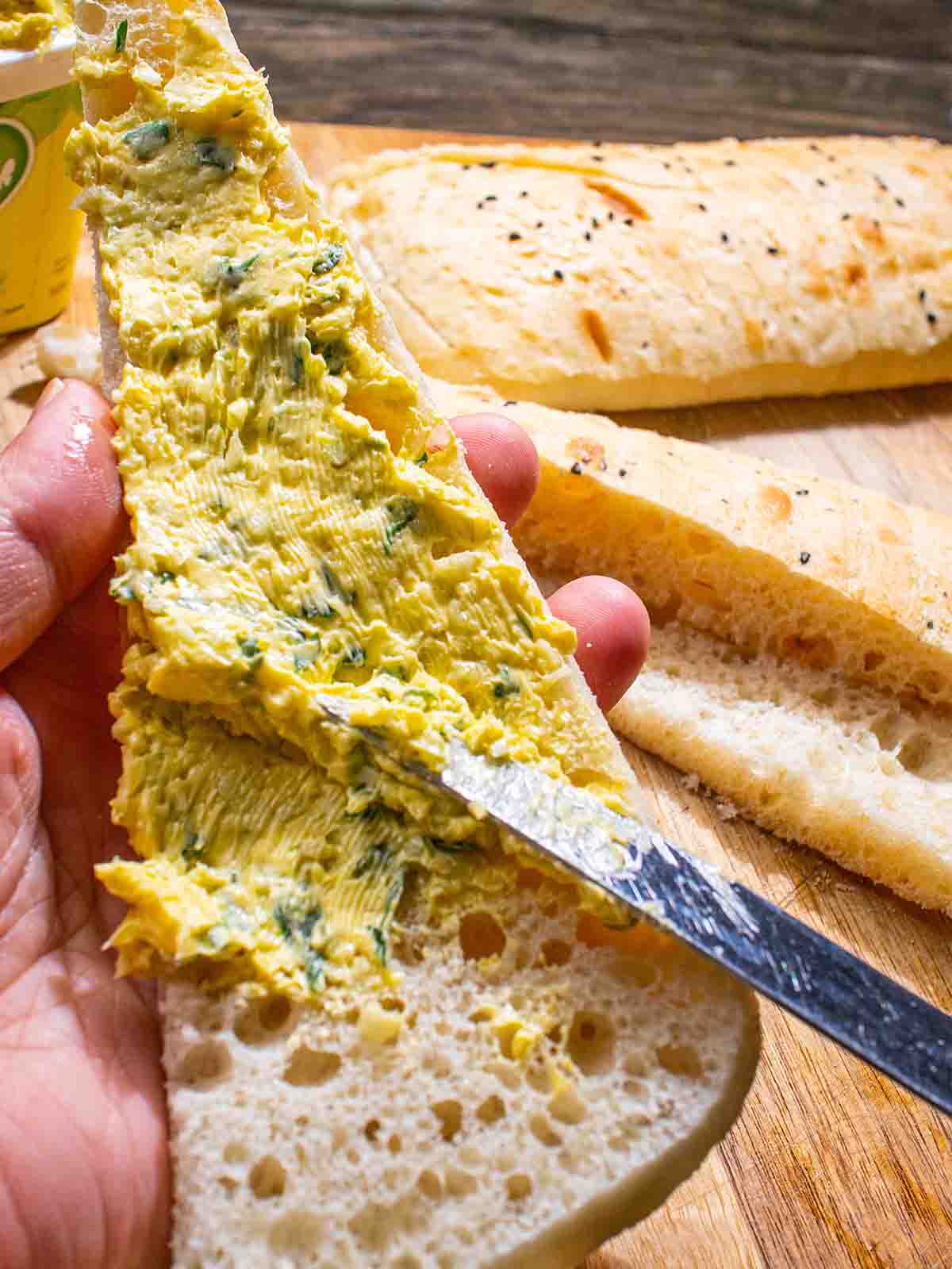 spread vegan garlic butter on breads