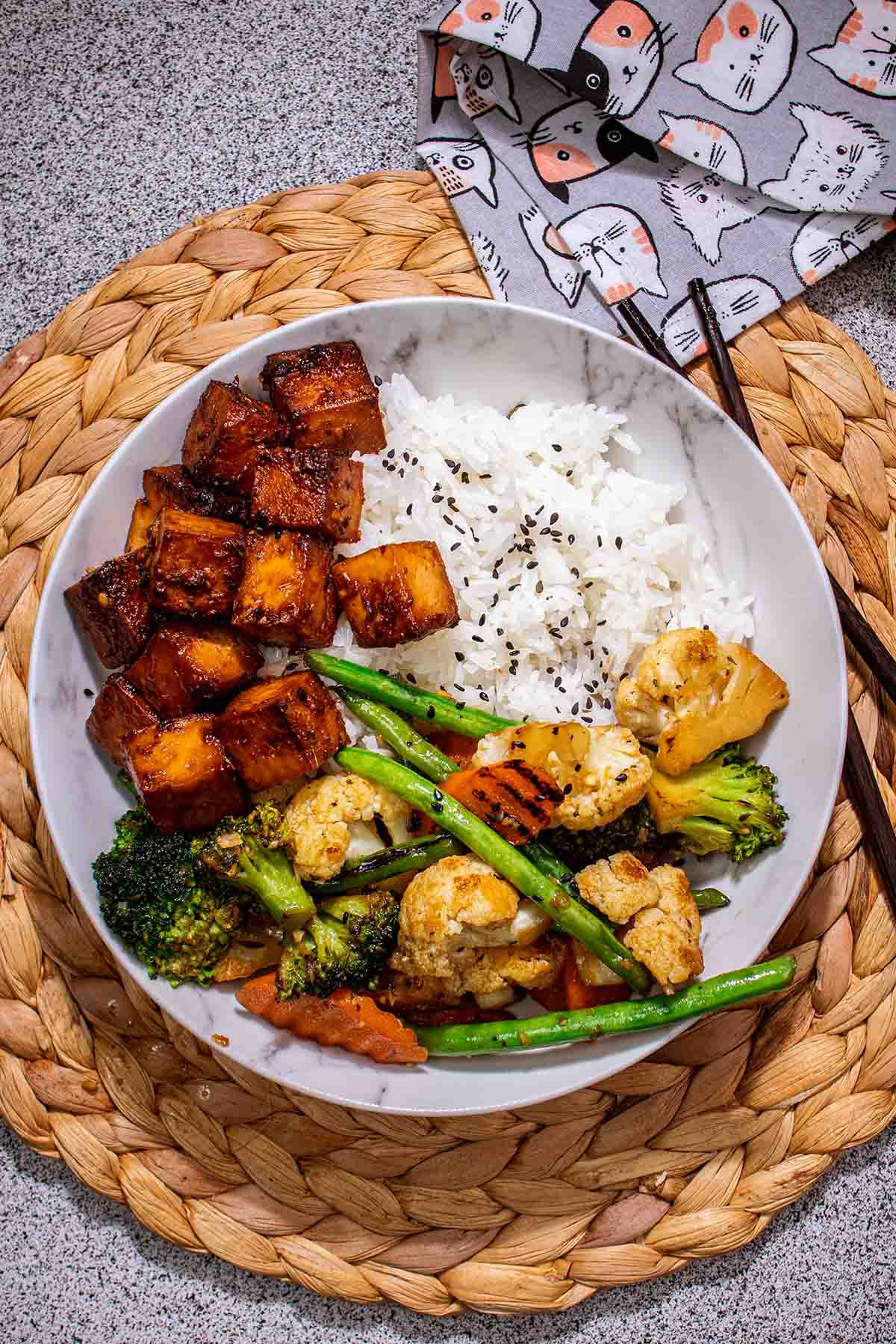 a bowl of rice, veggies, and tofu