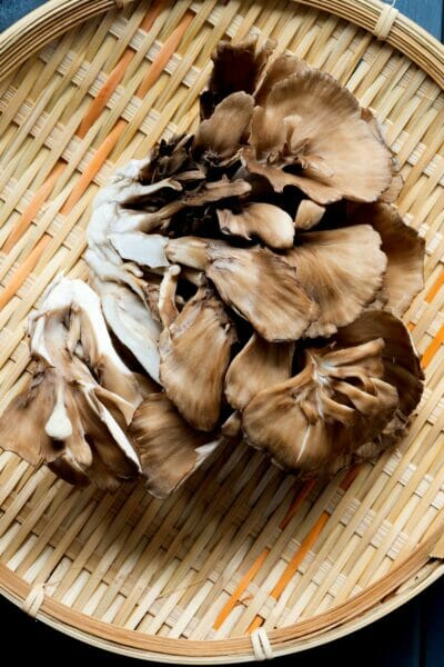 fresh mushrooms on a bamboo mat
