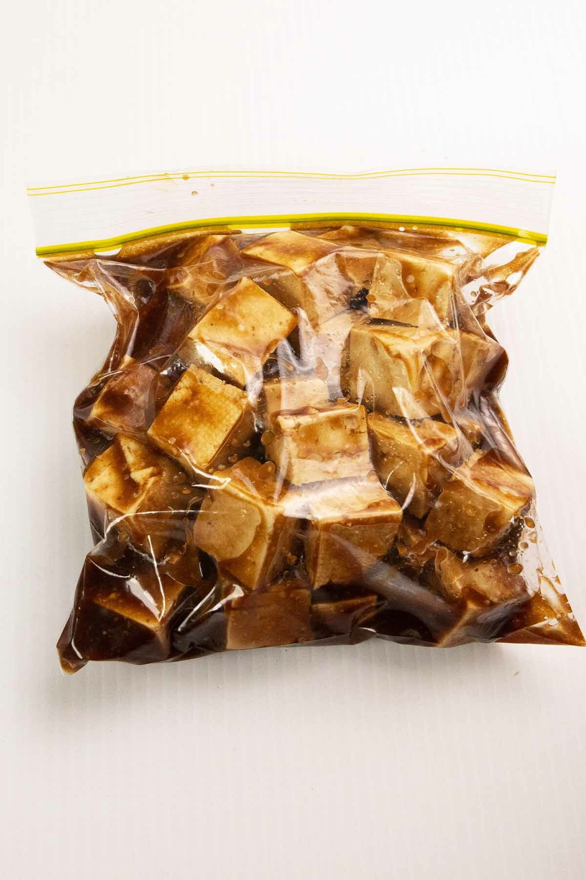 tofu with marinate sauce in a ziplock bag